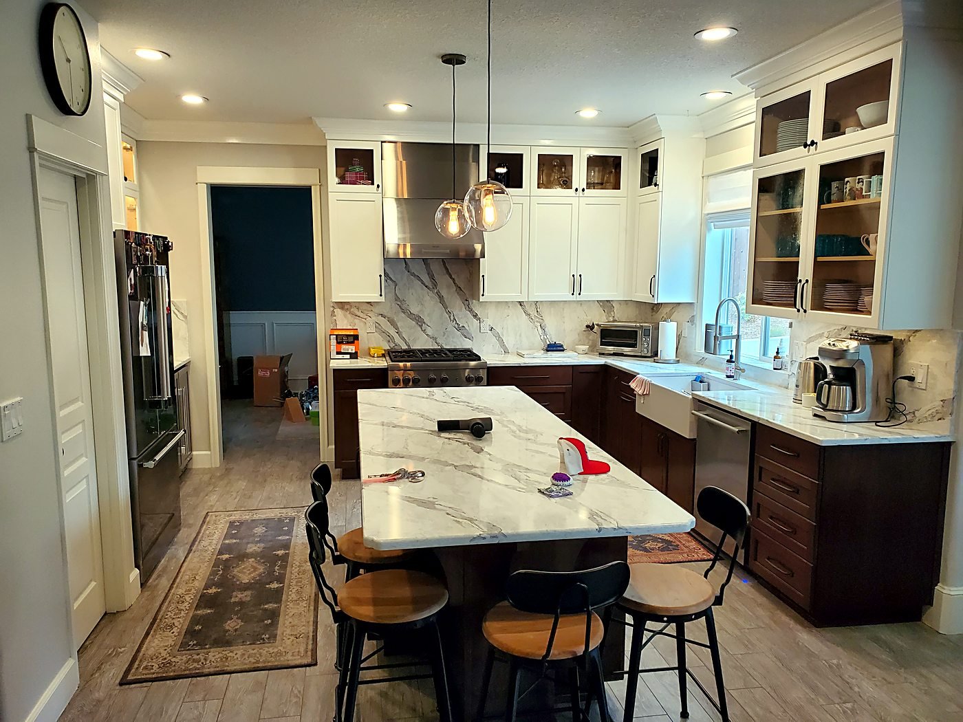 Finished custom kitchen remodel with island seating and pendant lighting