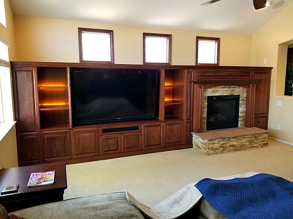 Custom built-in cabinetry and fireplace surround by LeMaster Inc.